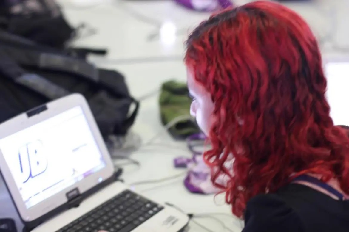 Photo of Sayonara Bittencourt as a 17-year old working on a mobile game