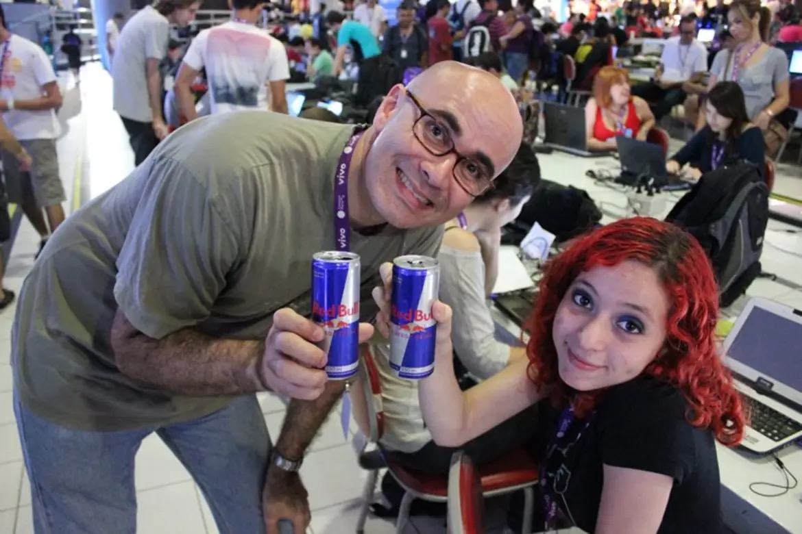 Photo of Sayonara Bittencourt as a 17-year old drinking a red bull with her game design teacher